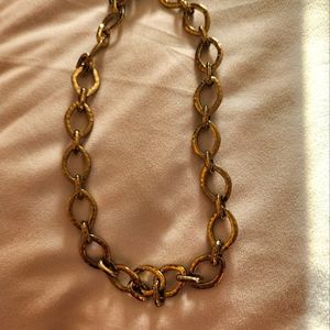 Gold tone choker necklace